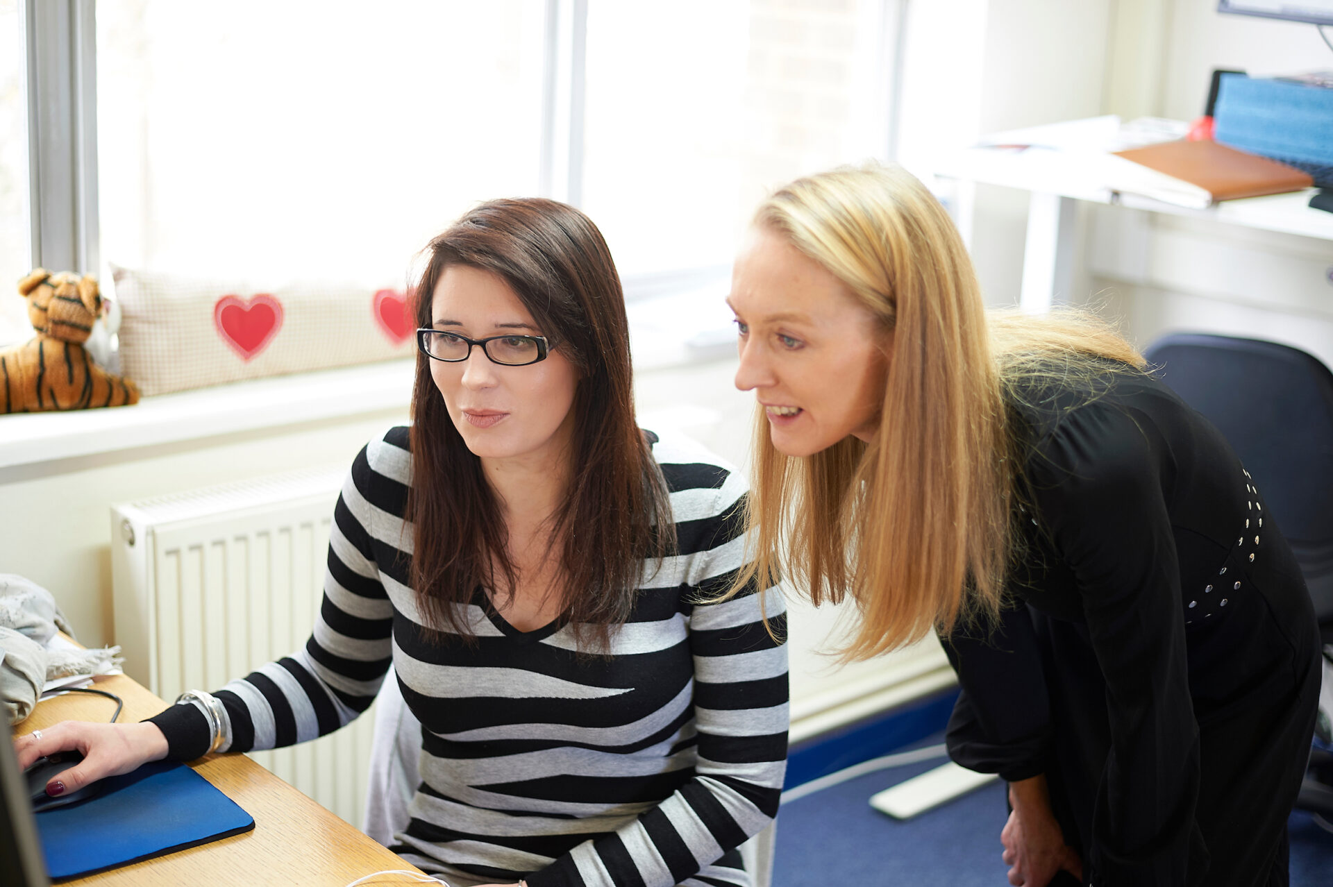 two of our life science consultants working at a desk