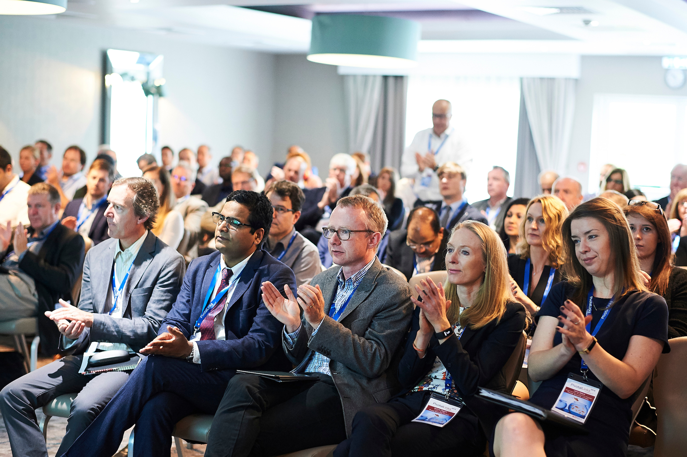 clients watching a presentation by one of our consultants