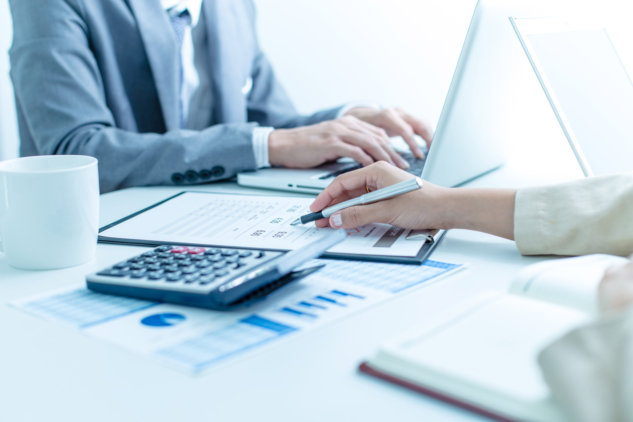 M&A business meeting showing people on a computer