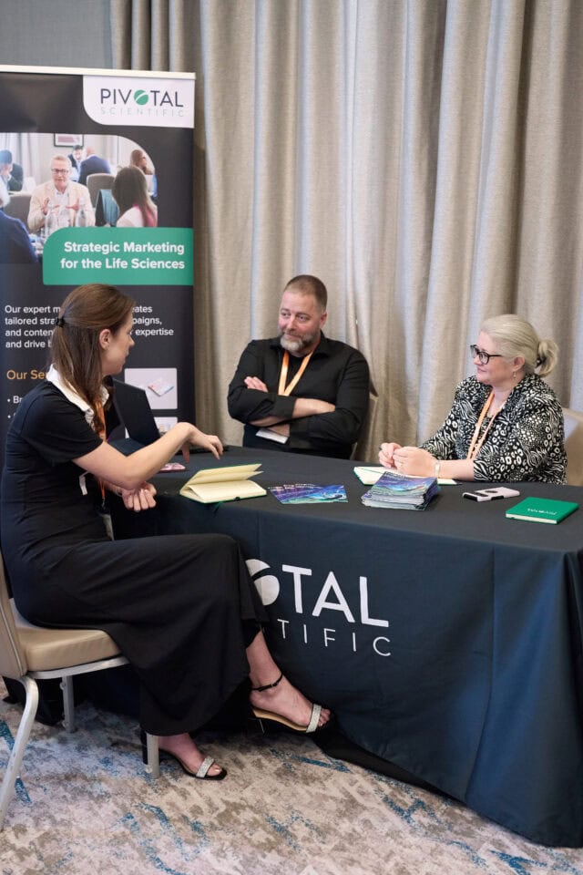 jenny and sian talking to a client